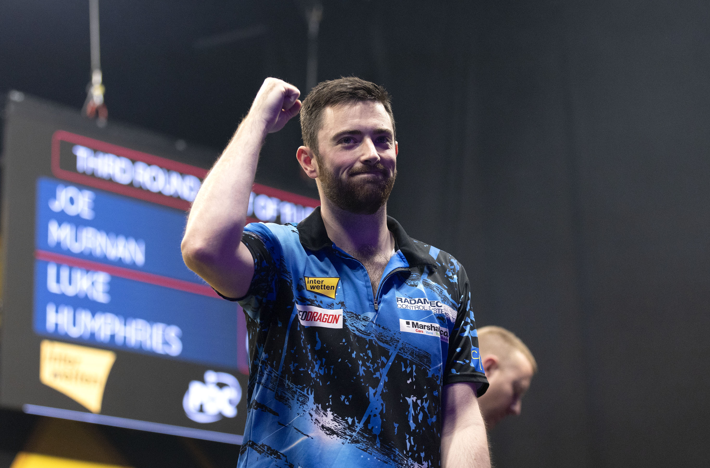 Luke Humphries celebrates victory at the European Darts Grand Prix